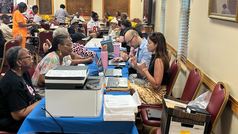 Senior citizens talking people from Delco Health Department