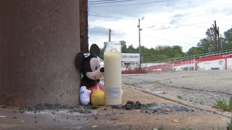 Mickey Mouse and a candle on the sidewalk near where Dorothea was struck and killed