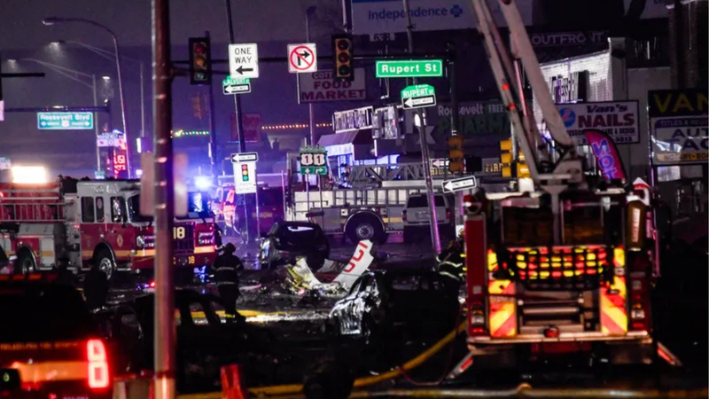 Emergency response crews on Cottman Avenue investigate the wreckage of the medical jet crash on Jan. 31, 2025.