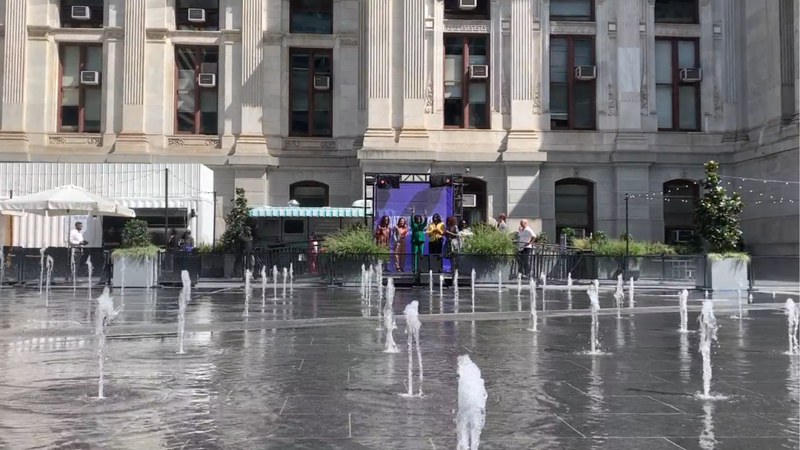 People conduct water patterns at Dilworth Park