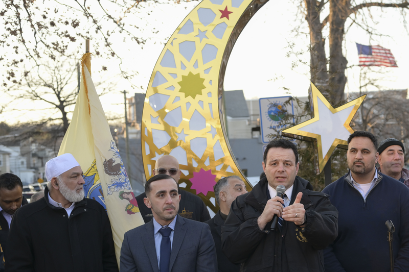 Mayor of Paterson, Andre Sayegh (2nd R) speaks during the traditional celebration of the Muslim holy month of Ramadan which starts on Wednesday in South Paterson, New Jersey on March 18, 2023.