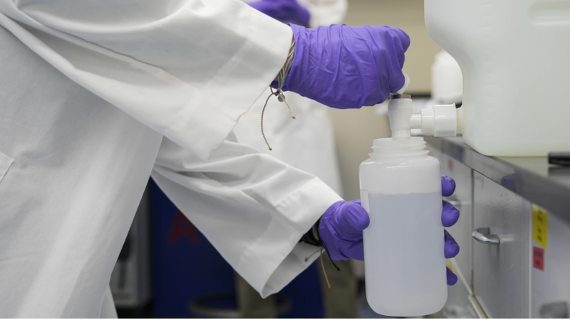 PFAS water sample poured into a container