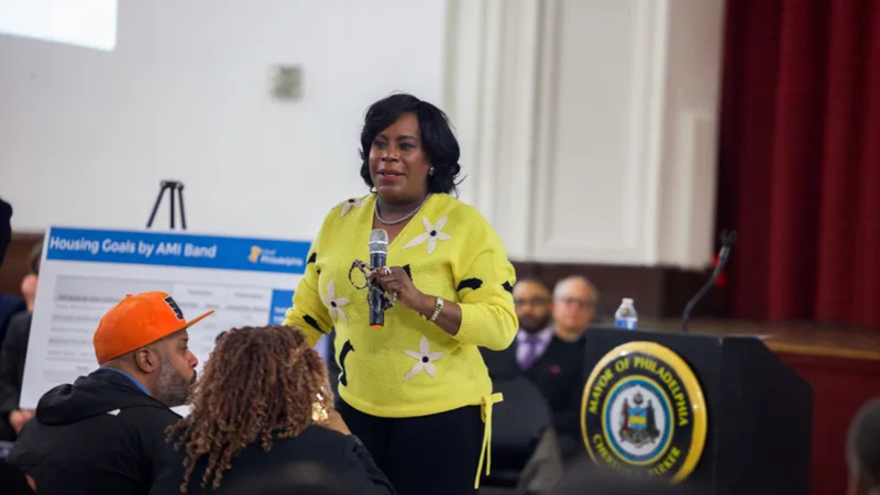 Mayor Cherelle Parker speaks in front of a podium about her Housing Initiative