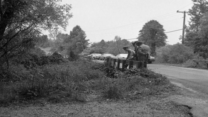 Officers search creek where a boy's dead body was found in 1972.