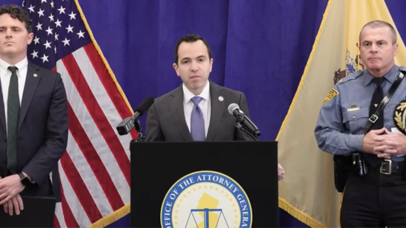New Jersey Attorney General Matthew Platkin speaking at podium.