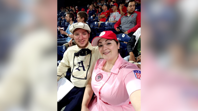Matt Albertson with his wife, Jess, at a Phillies game.