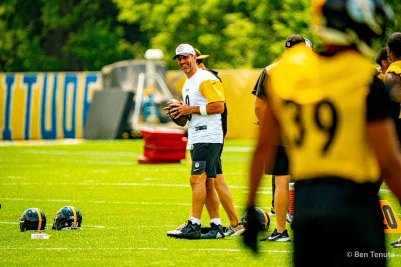 Aaron Rodgers smiling with Minkah Fitzpatrick in foreground