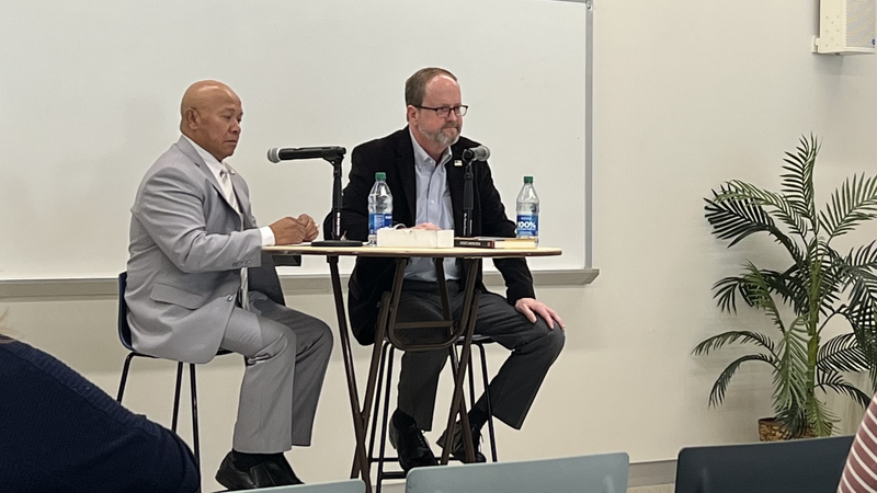 Leth Oun (left, with co-author Joe Samuel Starnes) discusses his new autobiography, "A Refugee's American Dream."
