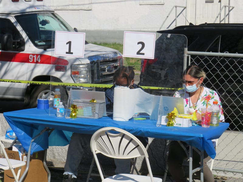 Registration table at a walk-up vaccination clinic, Hartford, 4/6/21