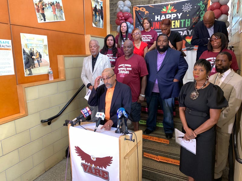 Universal Board Chair Christopher Hill addresses reporters Thursday about the pending closure of Vare Charter School.