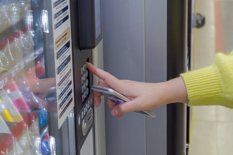 Woman at vending machine