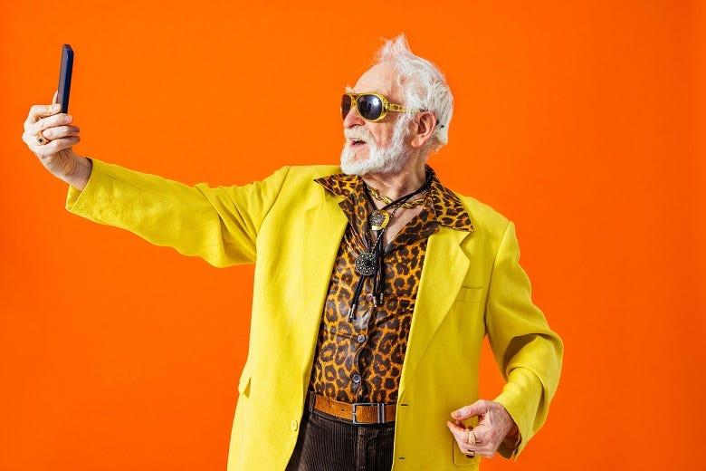 old man shooting a selfie