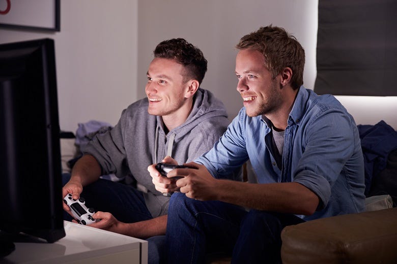 2 guys playing a video game 