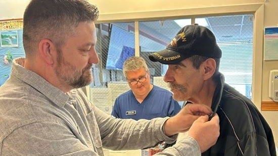 A vet was pinned by the Michigan Veteran Service Officer who helped him secure full disability benefits for his mental health wounds.