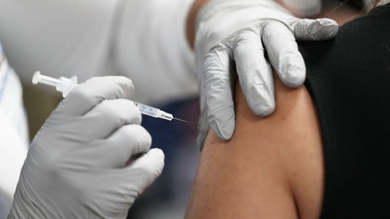  A healthcare worker at the Jackson Health Systems receives a Pfizer-BioNtech Covid-19 vaccine from Susana Flores Villamil, RN from Jackson Health Systems, at the Jackson Memorial Hospital on December 15, 2020 in Miami, Florida.