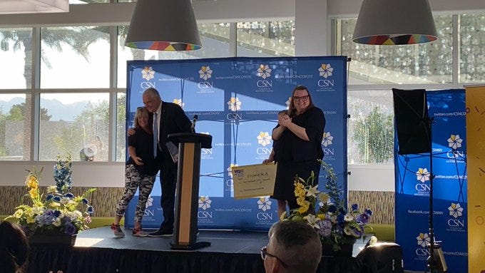 Governor Sisolak hugs a $250,000 winner during the first "Vax Nevada Days" drawing on July 8th, 2021