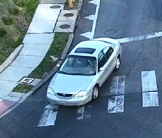 Police say the shooter escaped in this light-colored sedan.