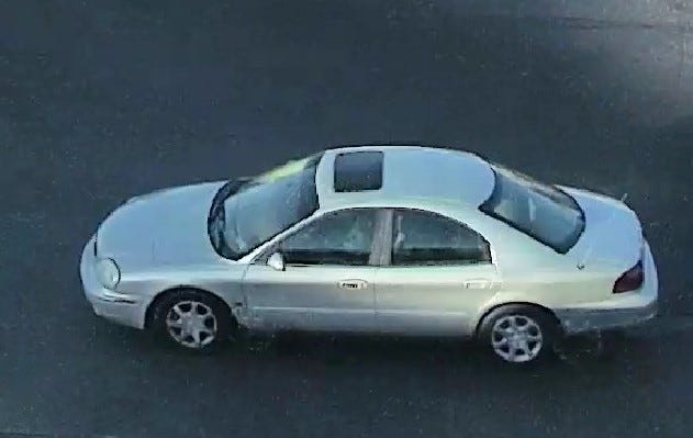 Police say the shooter escaped in this light-colored sedan.
