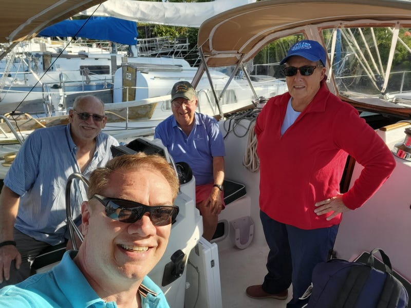 Diana Augspurger (in red) and local veterans after a recent sail