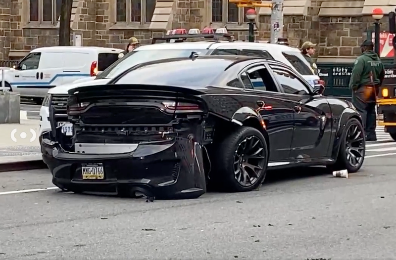 An out-of-control driver pinned an on-duty police officer in Greenwich Village Friday morning,