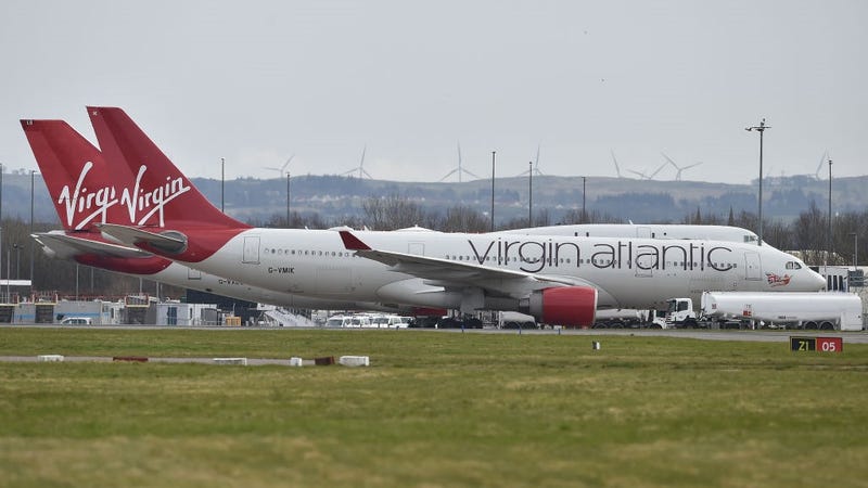 Virgin Atlantic planes sit on the runway at Glasgow Airport on March 21, 2020 in Glasgow, Scotland.