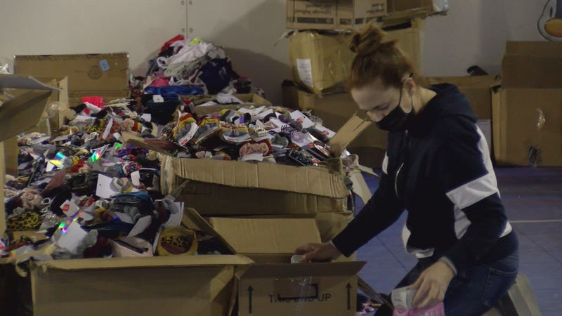 Volunteer sorts donated items