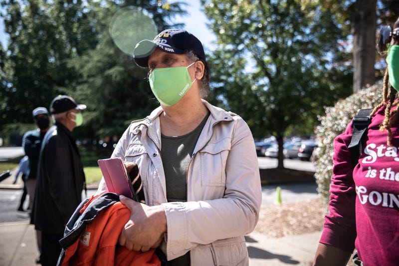 Carole Nesmith, of Greenville, as she waited in line to cast her vote at Greenville County Square, Monday, October 19, 2020.