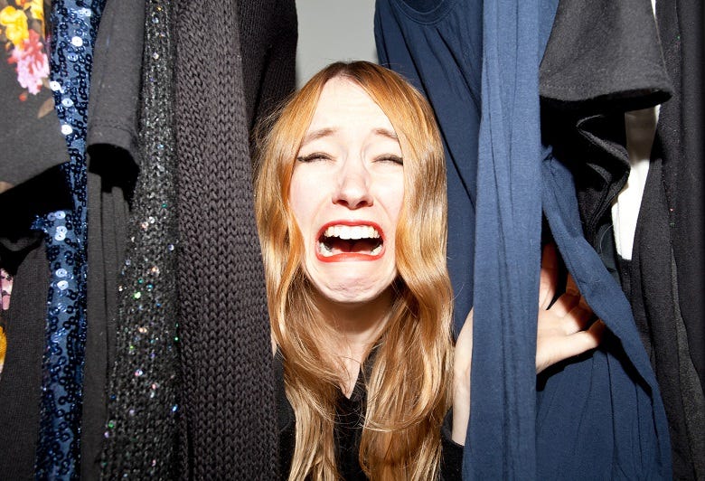 woman hiding in closet screaming