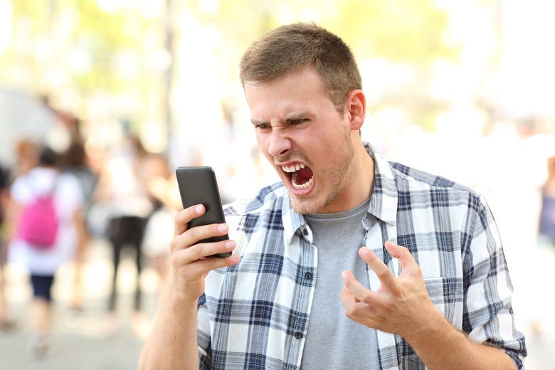 angry man answering cellphone 
