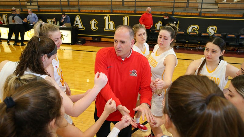Gwynedd Mercy University head women's basketball coach Keith Mondillo with some of his players.