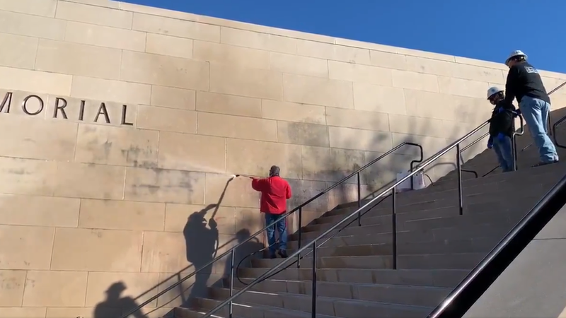 graffiti being sprayed off the outside of the WWI museum in Kansas City, MO