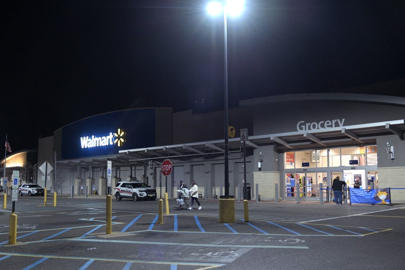 Customers exit a 24 hour Walmart on Black Friday November 27, 2020 in Neptune City, New Jersey