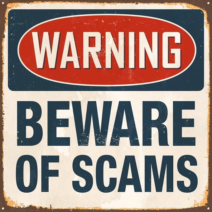 A sign warning people to beware of scams