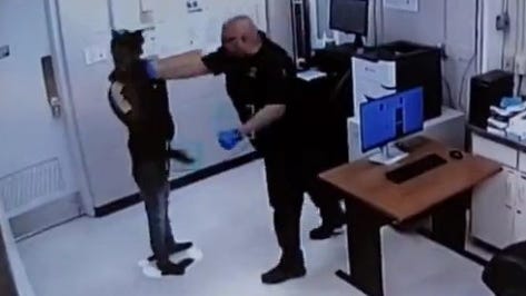 'A disgrace': Warren police officer charged with assault and battery for jail booking room attack caught on camera [VIDEO]