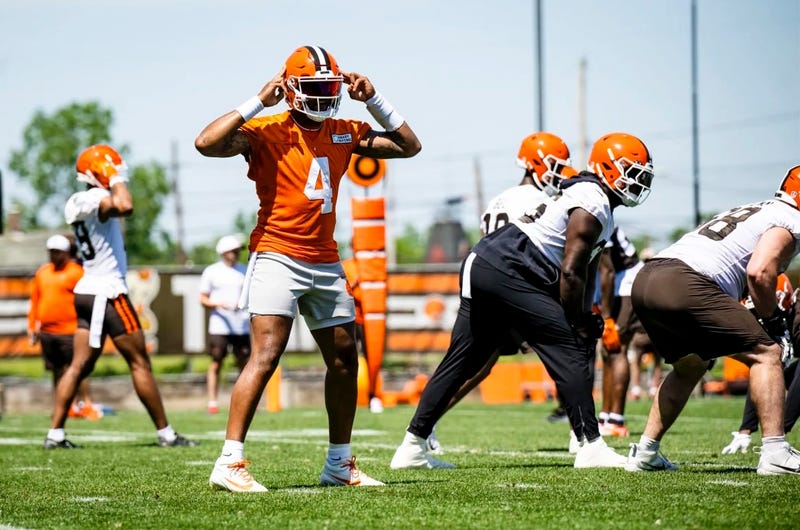 Browns quarterback Deshaun Watson signals during a OTA session