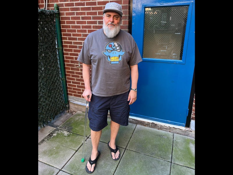 Wayne Rada, 52, was beaten alongside his husband by a group of scammers pretending to be utility workers at their East Village apartment building earlier this month.