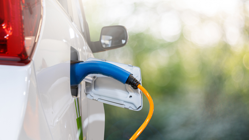 Electric vehicle being charged