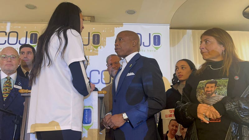 Mayor Eric Adams being presented with a hostages' pin at the annual legislative breakfast for COJO on April 7, 2024.