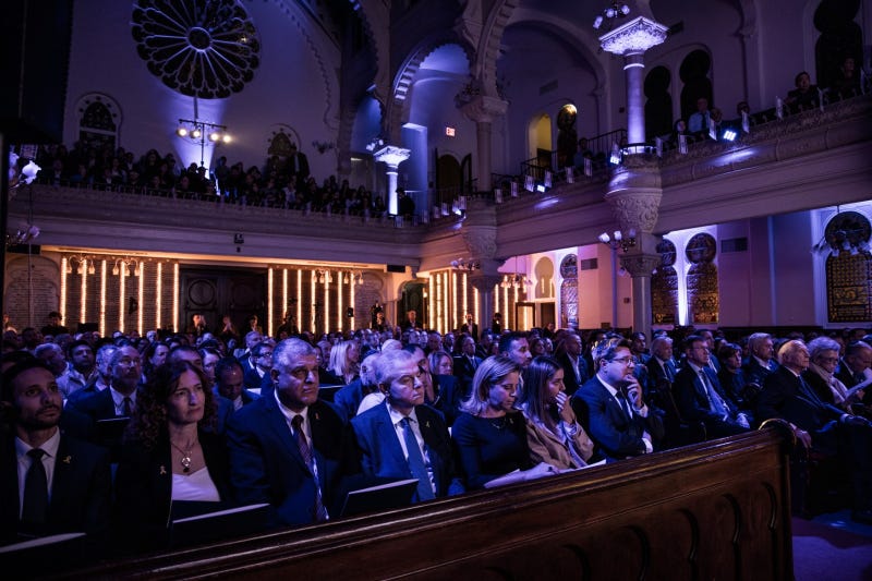 The crowd of about 600 at Park East Synagogue for the October 7 commemoration ceremony. Israel's consul general Ofir Akunis is at the far right. 