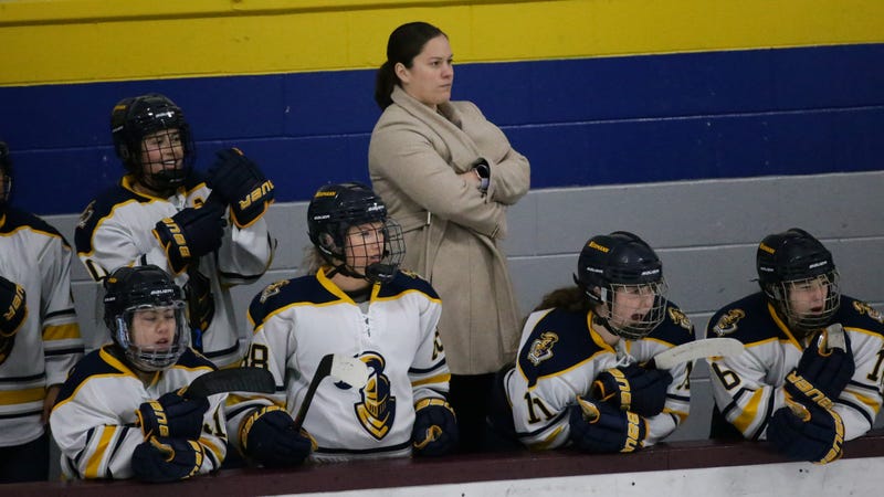 Gina McLaughlin coaching the Neumann University Knights women's hockey team.