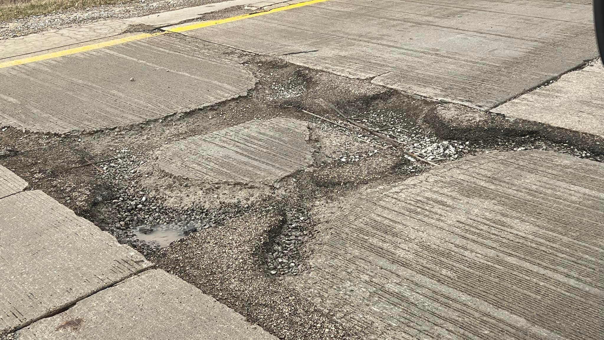 The Mother of all Potholes: crews work to quickly address gigantic crater on exit ramp off I-75