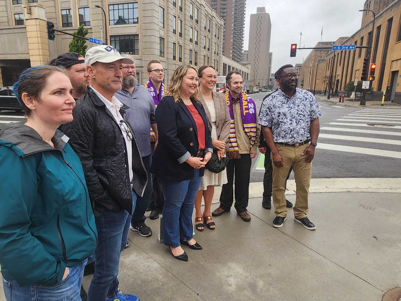 Union workers, lawmakers and downtown residents gathered at the entrance to the Third Avenue Bridge across the street from the 39-story Carlisle Condo Building on Tuesday in Minneapolis.