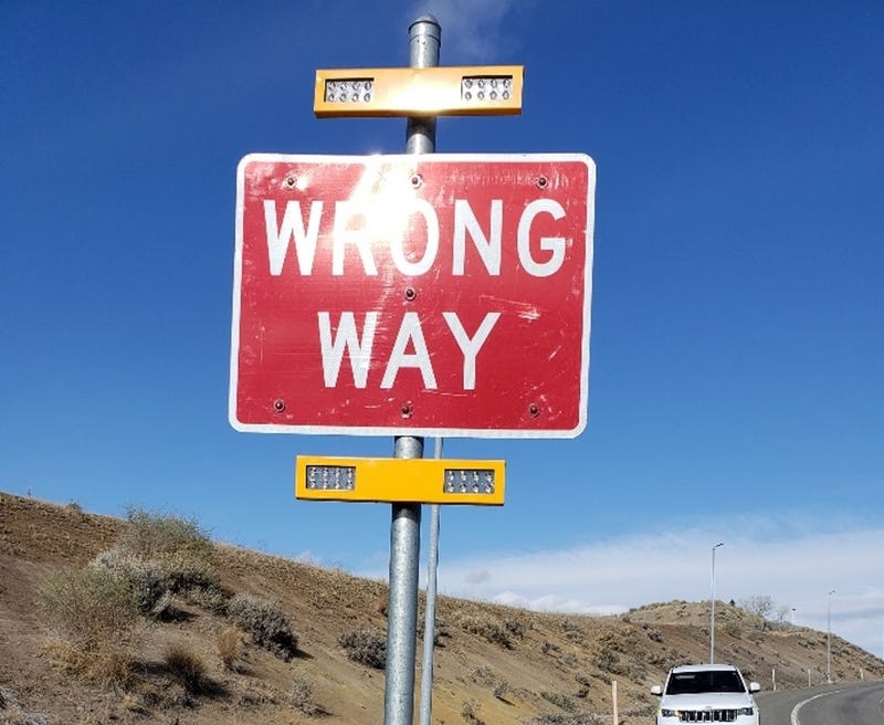 A sign warns drivers that they're going the wrong way