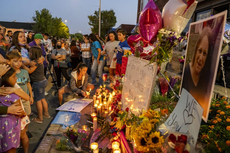 Around 200 family, friends and community members gather for a vigil for Yvonne Ruzich outside Baltimore Food & Liquor Store in the Hegewisch neighborhood, Monday, Aug. 16, 2021. Ruzich was shot and killed earlier this morning in the 13300 block of South Baltimore Ave.
