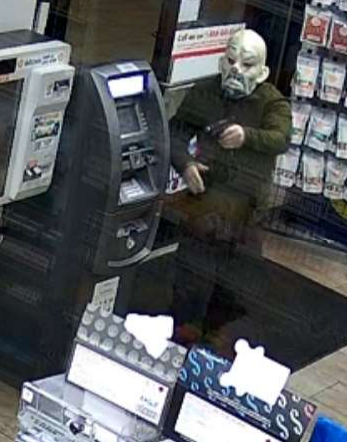 Man in black in clown mask
