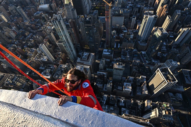 Jared Leto hangs on -- while attached to a harness -- to the Empire State Building on Nov. 9, 2023, as part of a promotion for his band Thirty Seconds to Mars' 2024 world tour.