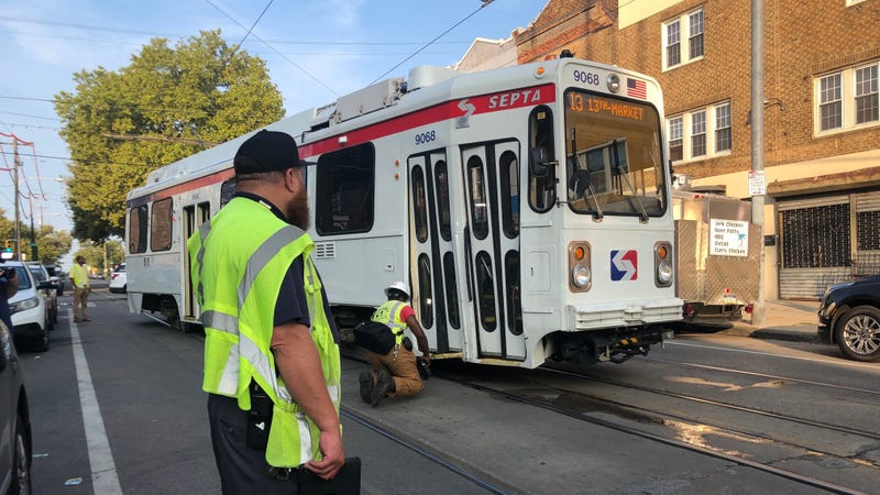A car collided with a trolley Sunday morning, knocking it off its tracks at the intersection of 52nd Street and Chester Avenue for several hours.