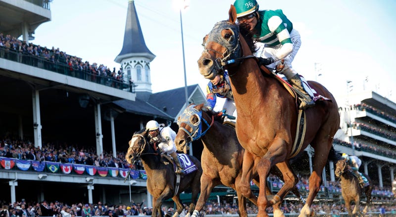 Nov 3, 2018; Louisville, KY, USA; Jockey Joel Rosario aboard Accelerate (14) wins the Breeders Cup Classic during the 35th Breeders Cup world championships at Churchill Downs. Mandatory Credit: Brian Spurlock-USA TODAY Sports