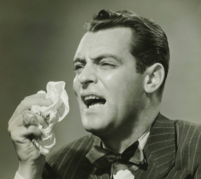 man sneezing