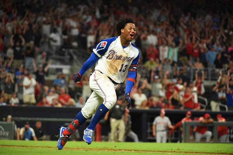 Braves left fielder Ronald Acuna Jr. is hit by the first pitch of the game against the Miami Marlins on Aug. 15, 2018, at SunTrust Park in Atlanta.